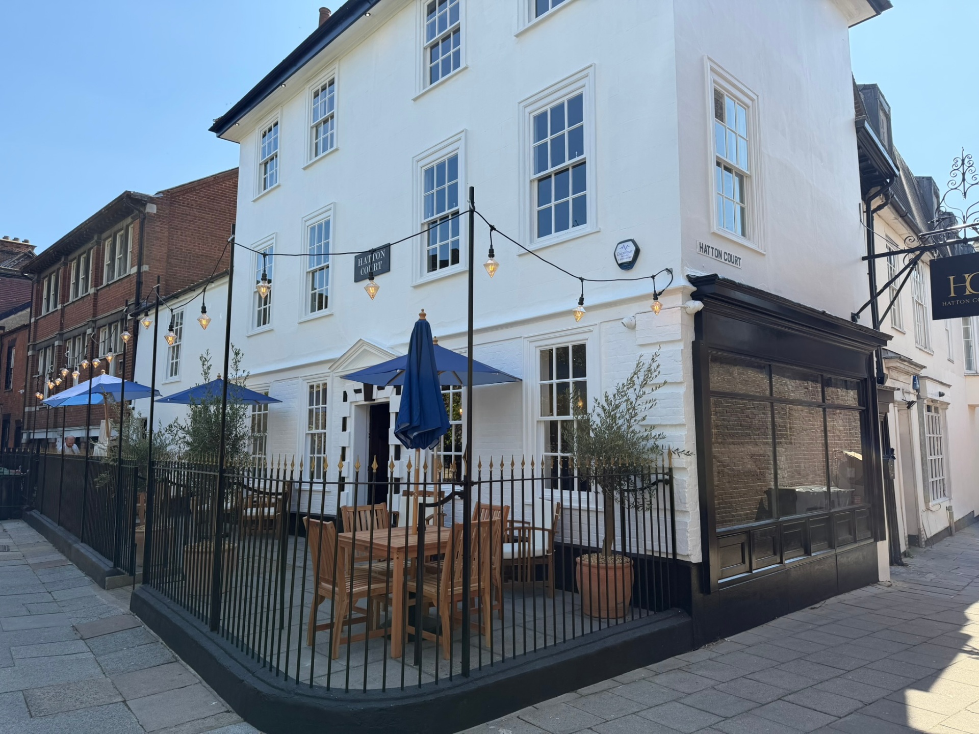 The Hatton Court Georgian townhouse exterior on Tower Church Yard, Ipswich, with outdoor seating
